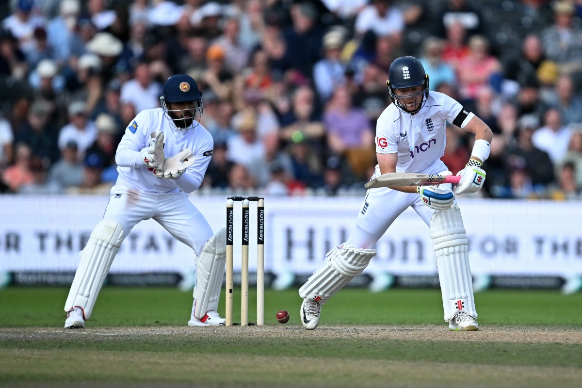 England's captain Ollie Pope plays a shot on day four of the first Test cricket match between England and Sri Lanka at Old Trafford cricket ground in Manchester, north-west England on August 24, 2024. (Photo by Paul ELLIS / AFP)