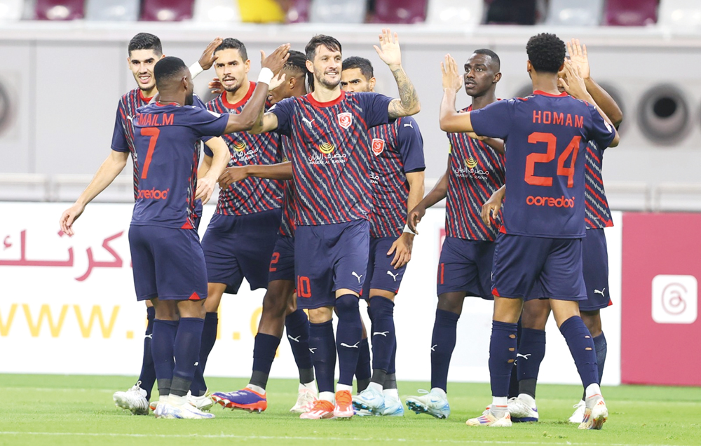 Al Duhail players celebrate their win over Umm Salal at Khalifa International Stadium on Thursday.