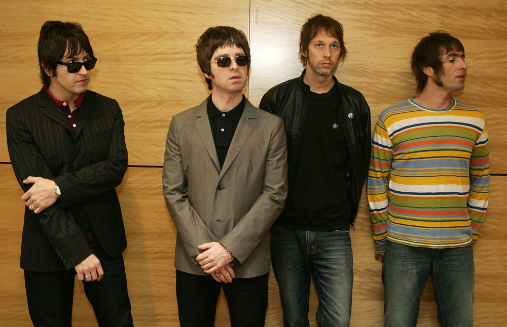 Gem (L), Noel Gallagher (2L), Andy Bell (2R) and Liam Gallagher, members of the British rock band 