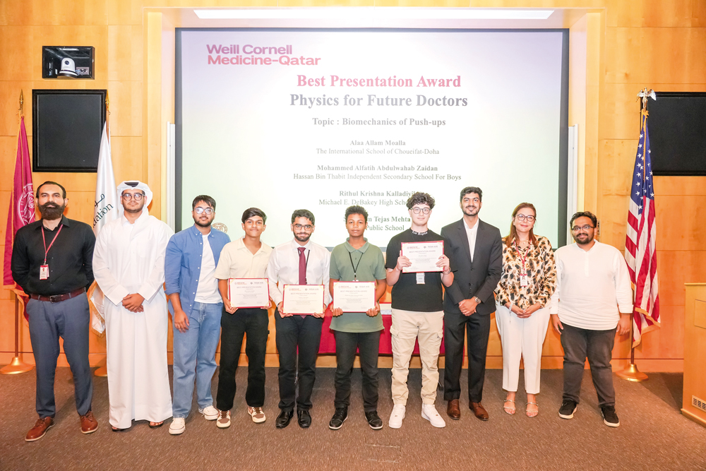 Officials from WCM-Q and TAMUQ with the winners of the best presentation award.
