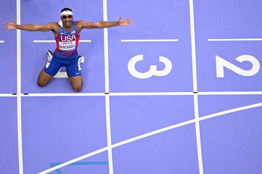 An overview shows US Jayden Blackwell reacting after winning the men's 100 T38 final event at the Stade de France, Saint Denis, north of Paris on August 31, 2024, during the Paris 2024 Paralympic Games. (Photo by Martin BUREAU / AFP)
