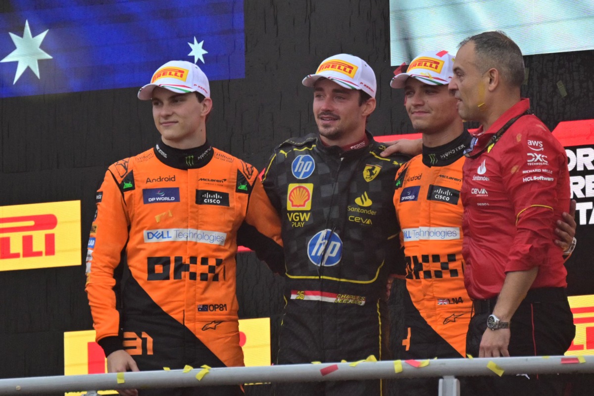 Second placed McLaren's Australian driver Oscar Piastri (L), First placed Ferrari's Monegasque driver Charles Leclerc and third placed McLaren's British driver Lando Norris (2nd R) celebrate on the podium after the Italian Formula One Grand Prix race at Autodromo Nazionale Monza circuit, in Monza on September 1, 2024. (Photo by Andrej ISAKOVIC / AFP)