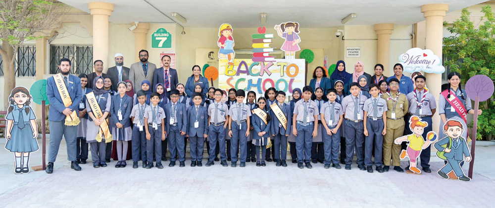 Students and the teaching staff on the first day of school reopening yesterday.