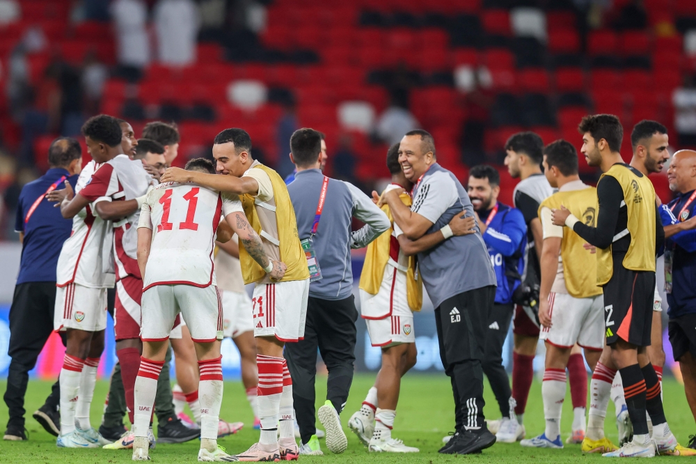 UAE's players celebrate after winning the FIFA World Cup 2026 Asia zone qualifiers football match between Qatar and the United Arab Emirates at the Ahmad Bin Ali Stadium on September 5, 2024. (Photo by Karim Jaafar / AFP)