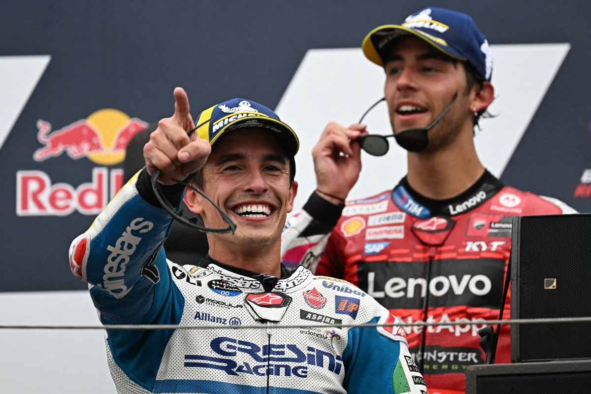 Winner Gresini Racing MotoGP's Spanish rider Marc Marquez and third placed Ducati Lenovo Team's Italian rider Enea Bastianini celebrate on the podium after the MotoGP race at the Misano World Circuit Marco-Simoncelli in Misano Adriatico on September 8, 2024. Photo by Gabriel BOUYS / AFP.