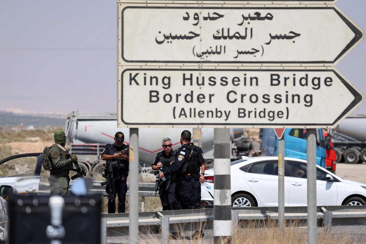 Israeli security forces gather at the scene of a reported attack near the Allenby Crossing between the occupied West Bank and Jordan on September 8, 2024, where the Israeli military said a truck driver opened fire, killing three Israelis. The (Photo by Ahmad GHARABLI / AFP)
