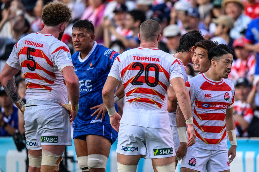 Japan's players celebrate their victory during the Pacific Nations Cup semi-final rugby union match between Japan and Samoa at the Prince Chichibu Memorial Rugby Ground in Tokyo on September 15, 2024. (Photo by Philip FONG / AFP)