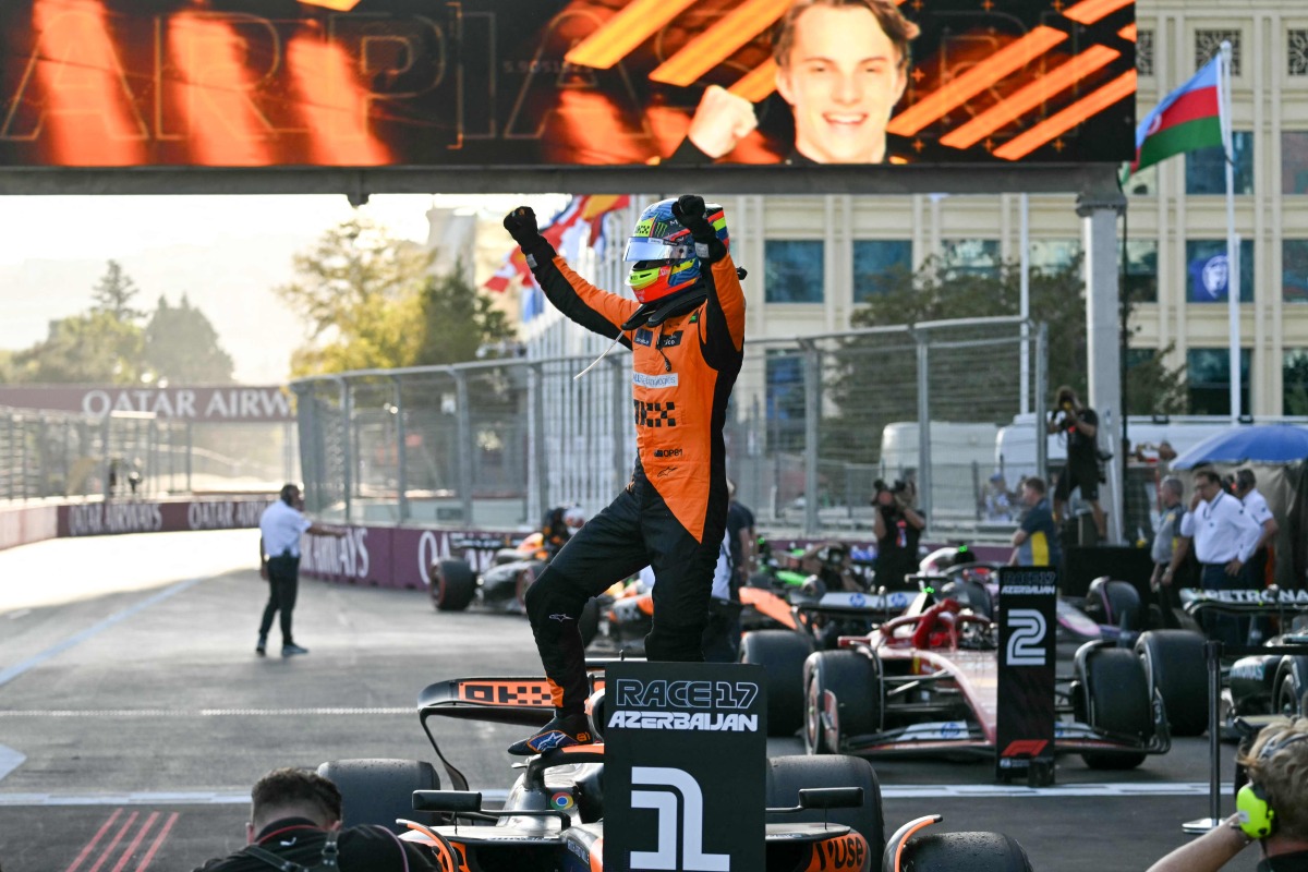 McLaren's Australian driver Oscar Piastri celebrates after winning the Formula One Azerbaijan Grand Prix at the Baku City Circuit in Baku on September 15, 2024. (Photo by Andrej ISAKOVIC / AFP)
