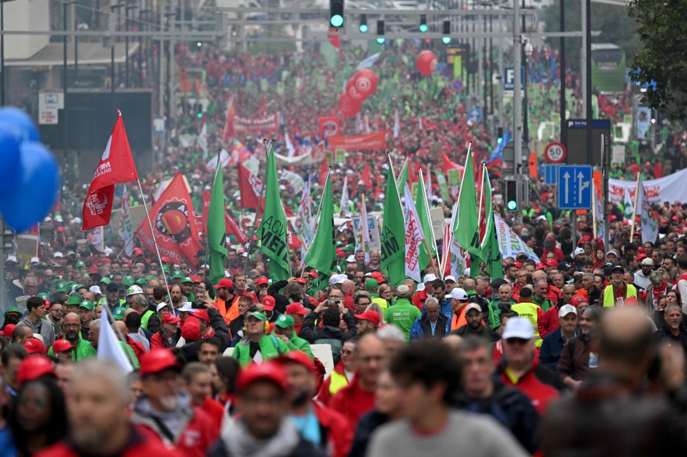 Protestors march during a demonstration in support of the employees of the Audi factory threatened with closure in Belgium and to call on the European Union to invest in the industrial sector, in Brussels on September 16, 2024. Photo by Nicolas TUCAT / AFP