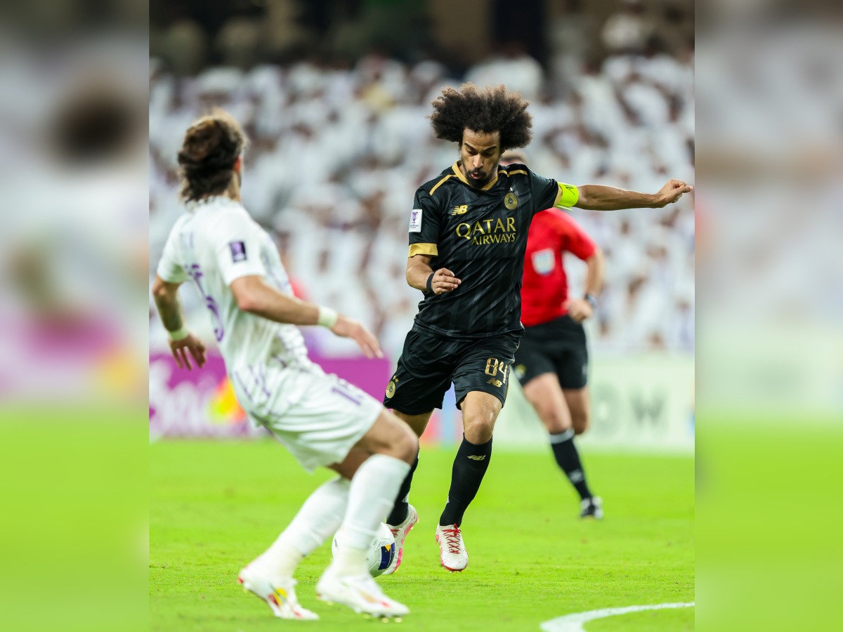 Al Sadd's Akram Afif (right) vies for the ball with an Al Ain player during yesterday's match.