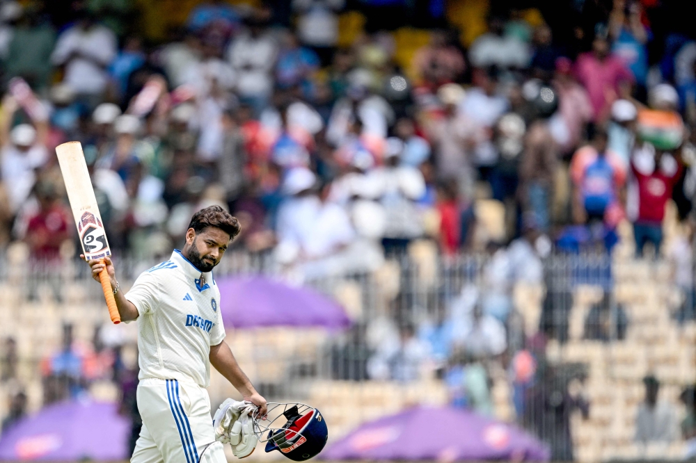 India's Rishabh Pant gestures as he walks back to the pavilion after his dismissal between India and Bangladesh at the M.A. Chidambaram Stadium in Chennai on September 21, 2024. (Photo by R. Satish Babu / AFP)