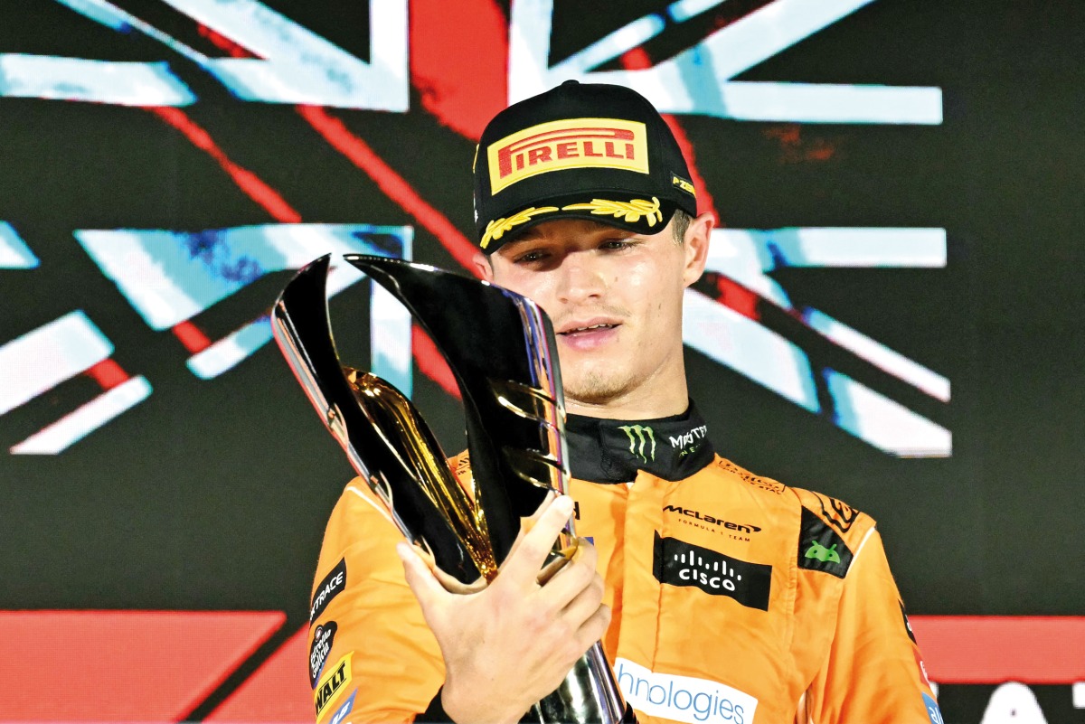 Ducati Lenovo Team’s Italian rider Enea Bastianini celebates with the winner's trophy.