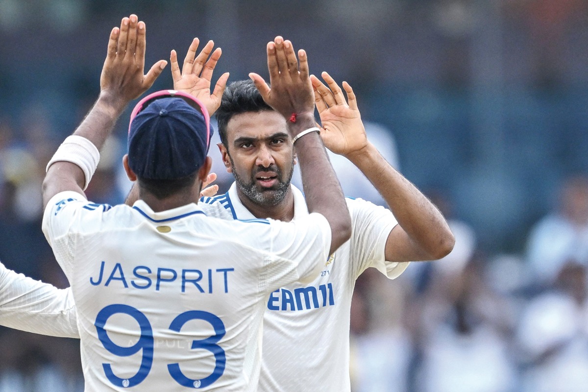 India’s Ravichandran Ashwin (right) celebrates with teammate Jasprit Bumrah after taking a wicket.