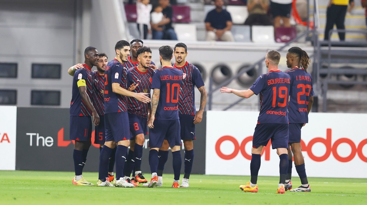 Al Duhail players celebrate after scoring a goal during their Week 5 match against Al Sadd.