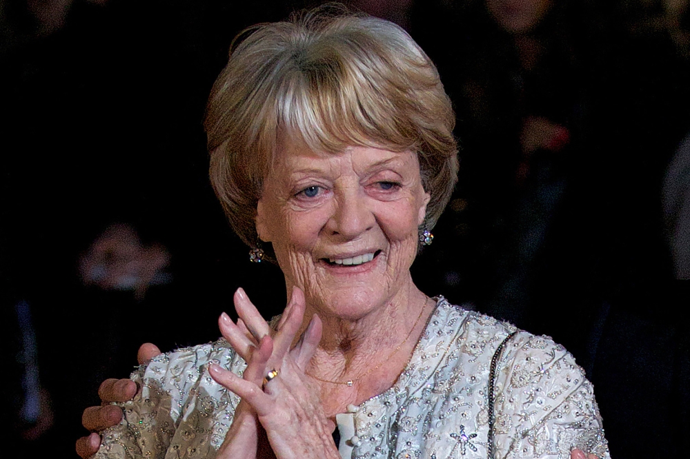 (FILES) A file photo taken on October 15, 2012, shows British actress Maggie Smith on the red carpet as she arrives to attend the premiere of 'Quartet' during the 56th BFI London Film Festival in London. Oscar-winning British actor Maggie Smith, a star of stage and screen for more than seven decades, died in hospital in London on Friday, September 27, her sons announced. (Photo by ANDREW COWIE / AFP)
