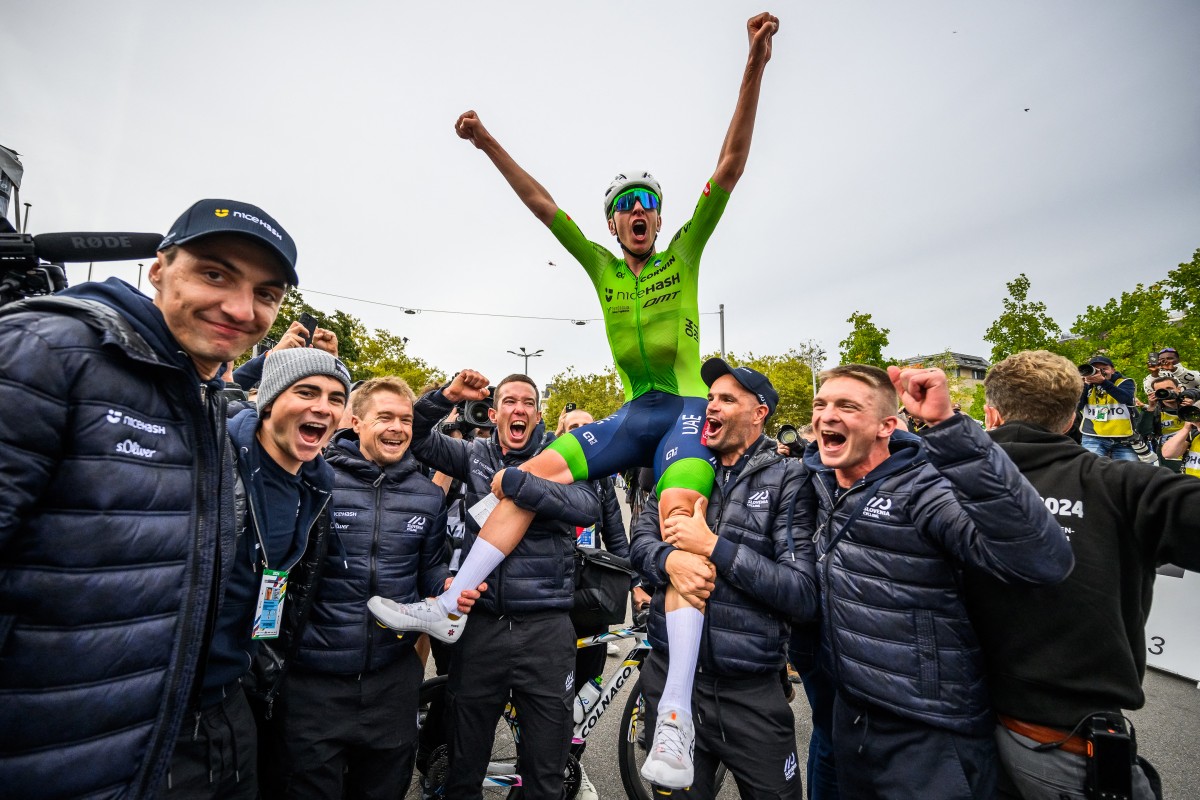 Slovenia's Tadej Pogacar celebrates with his team after winning the men's Elite Road Race cycling event during the UCI 2024 Road World Championships, in Zurich, on September 29, 2024. Photo by Fabrice COFFRINI / AFP.
