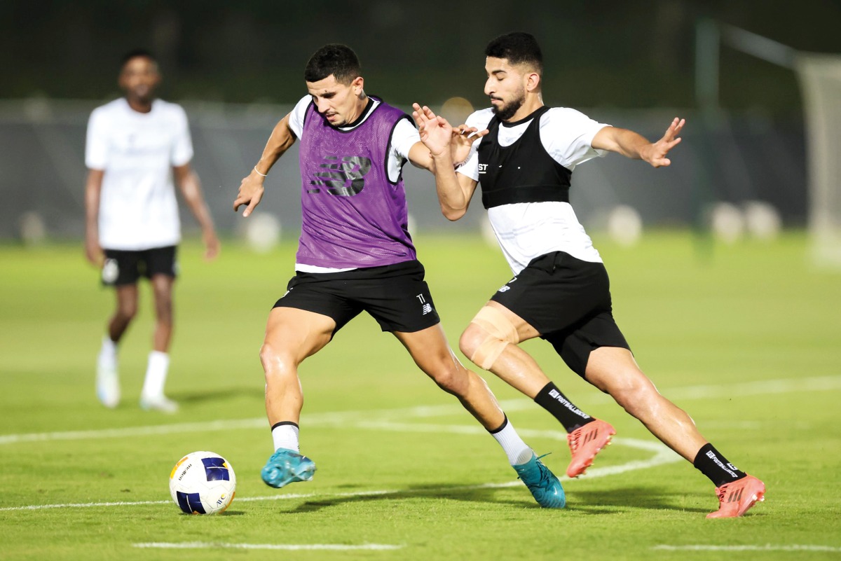 Al Sadd's Youssef Atal (left) and Mohammed Waad in action during a training session.