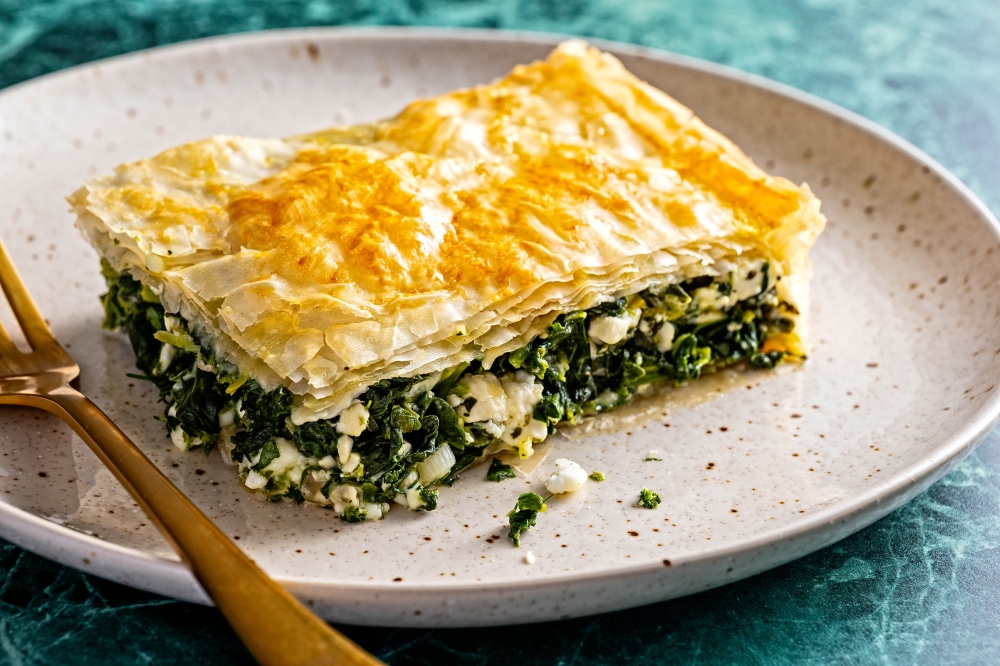 Greek mixed greens pie with phyllo crust. (Photo by Scott Suchman for The Washington Post; food styling by Lisa Cherkasky for The Washington Post)