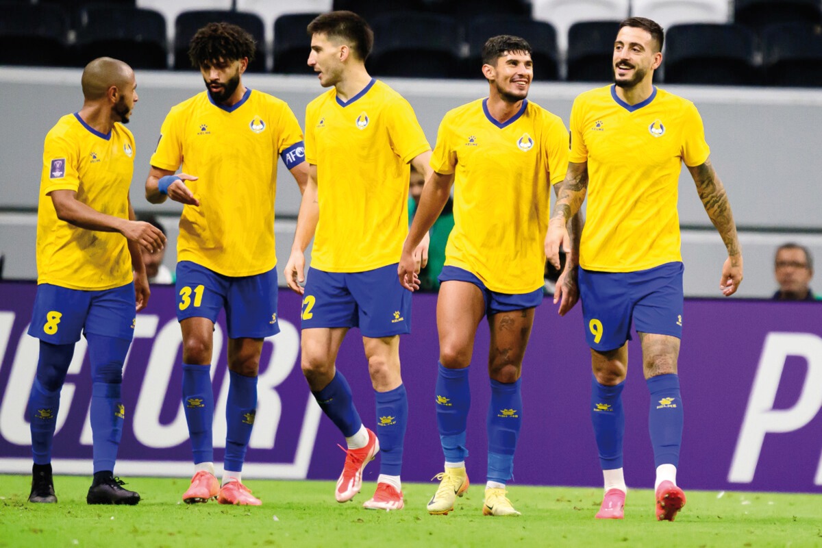 Al Gharafa players celebrate with Joselu (right) after the Spaniard scored their second goal. AFC