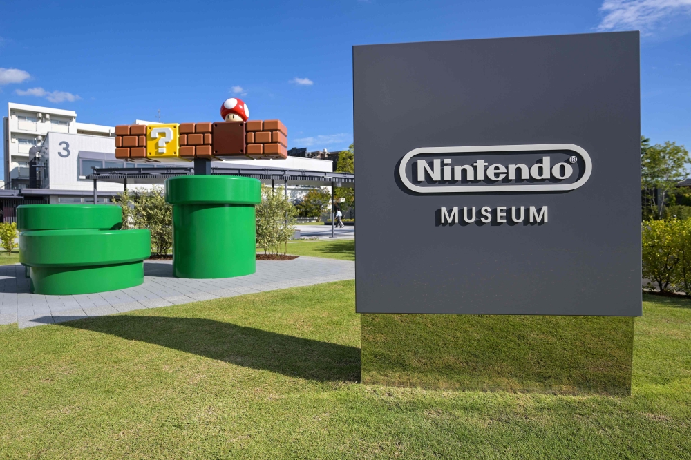 (Files) This photo taken on September 24, 2024 shows signage in the courtyard of the new Nintendo Museum, located inside a renovated old factory, during a media preview in suburbs of Kyoto. (Photo by Richard A. Brooks / AFP)