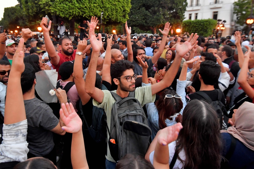 Tunisians shout slogans against President Kais Saied during a demonstration on October 4 2024, in Tunis. (Photo by Fethi Belaid / AFP)