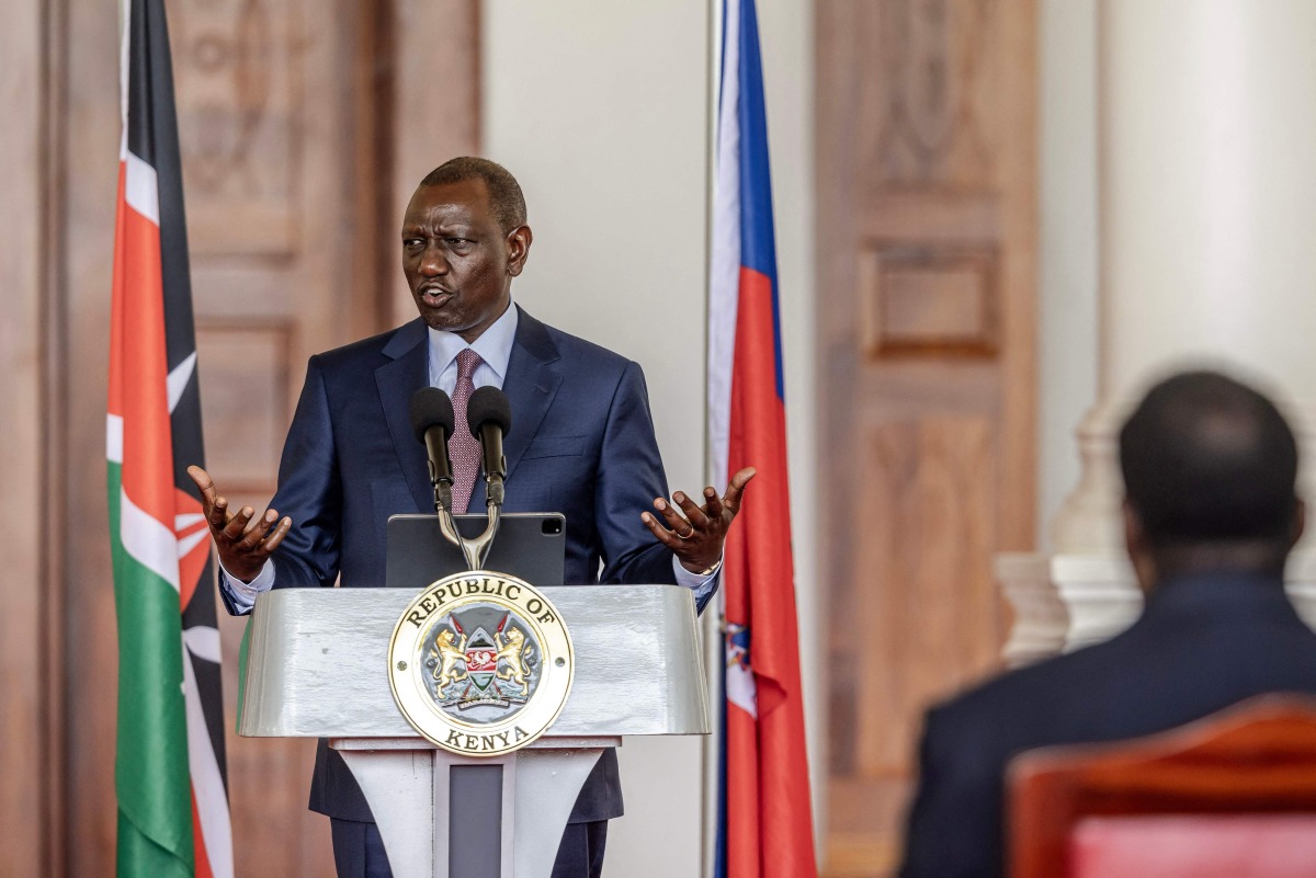 President of Kenya William Ruto delivers his remarks during a joint press conference with Prime Minister of Haiti Garry Conille (unseen) at the State House in Nairobi on October 11, 2024. (Photo by LUIS TATO / AFP)
