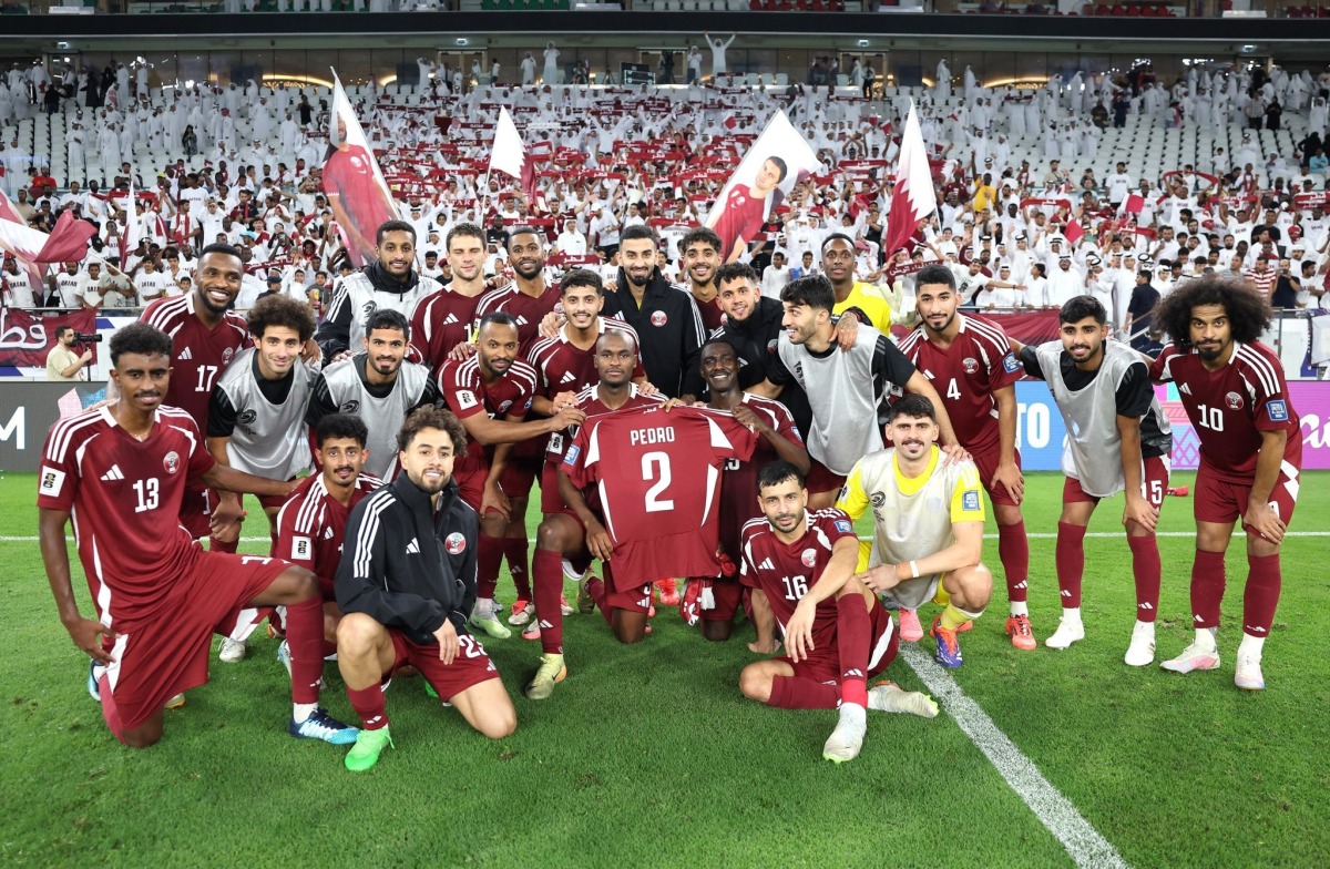 Qatar players honour injured teammate Pedro Miguel by showcasing his jersey after their victory over Kyrgyzstan. Miguel underwent successful surgery in London, his club Al Sadd announced yesterday.    