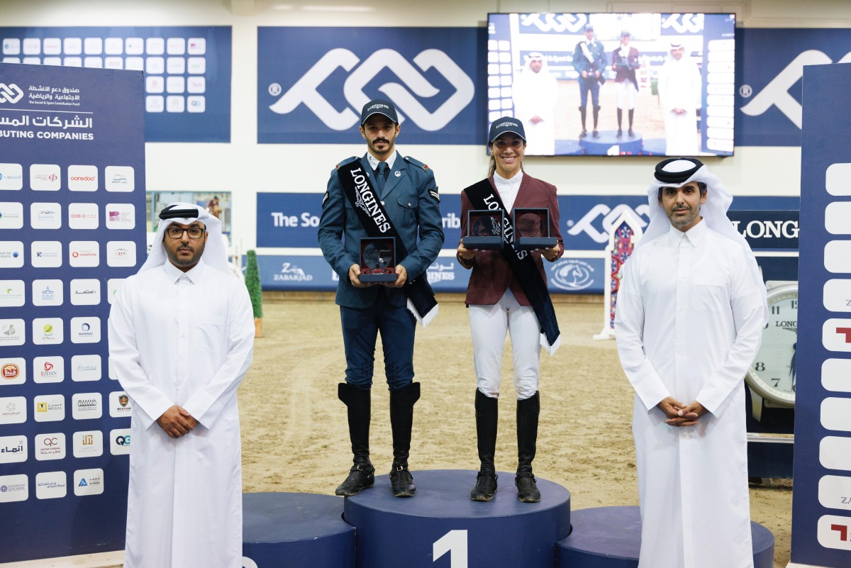 Ambassador of Qatar to the Republic of Azerbaijan, H E Faisal bin Abdullah Hamad Al Hanzab (right) crowned the Big Tour winners of Longines Hathab Round Two at the Qatar Equestrian Centre's indoor arena yesterday.