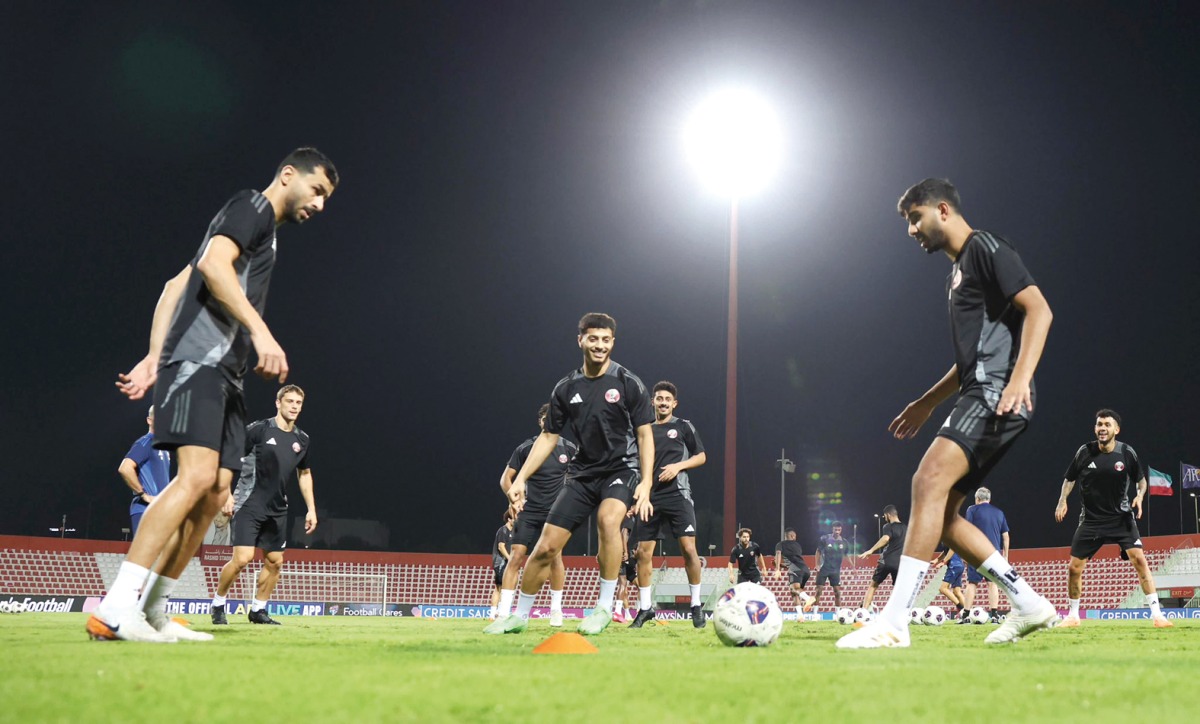 Qatar players attend a training session at Rashid Stadium in Dubai, yesterday.