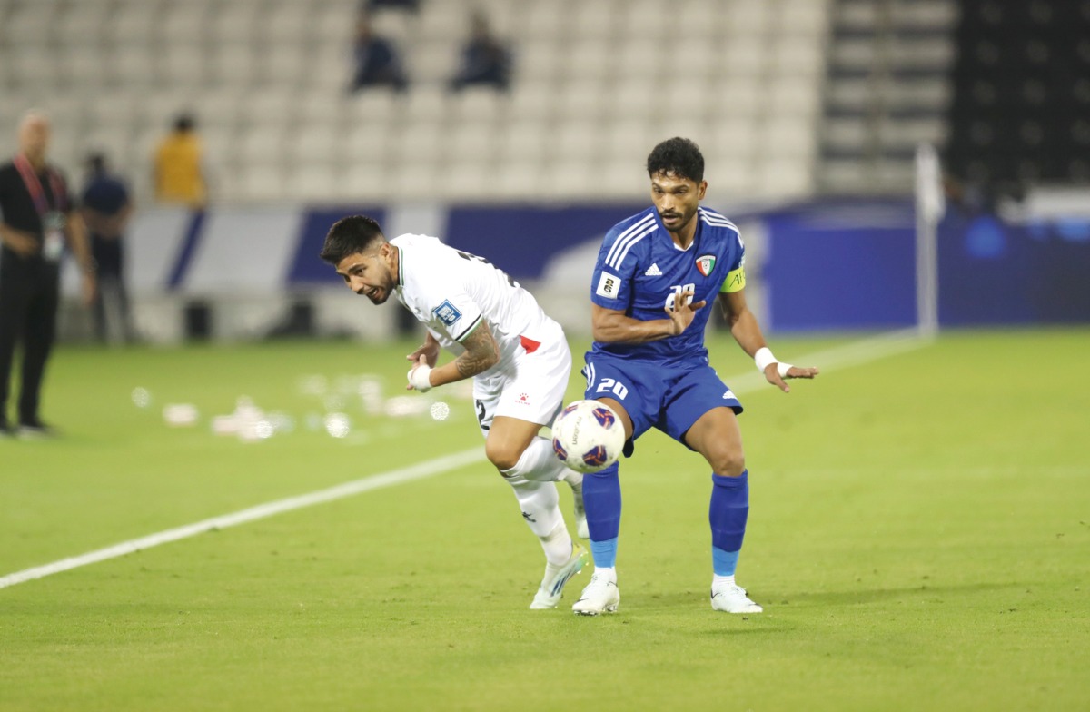 Action during the match between Palestine and Kuwait at the Jassim Bin Hamad Stadium yesterday. Pic: AMR DIAB / THE PENINSULA