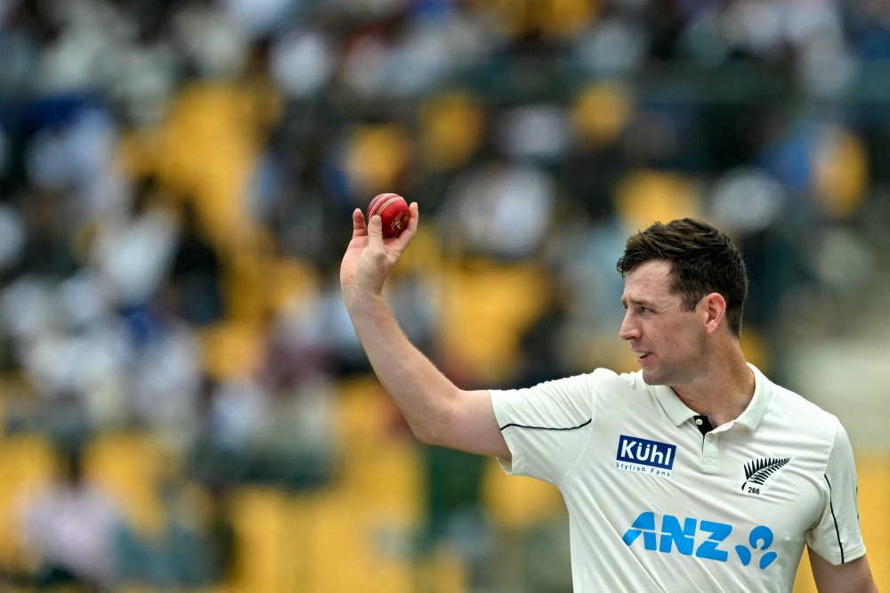 New Zealand's Matt Henry gestures during the second day of the first Test cricket match between India and New Zealand at the M. Chinnaswamy Stadium in Bengaluru on October 17, 2024. (Photo by Idrees Mohammed / AFP) /