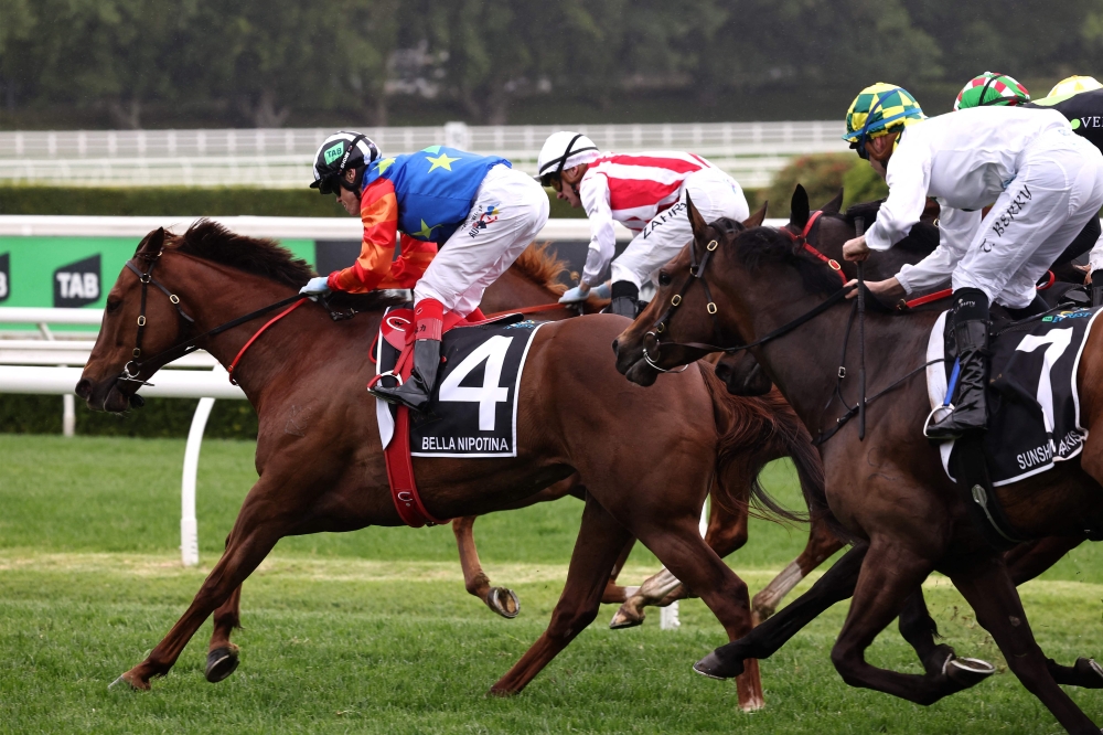 Bella Nipotina (L), ridden by the jockey Craig Williams, wins the Everest 2024 race at the Royal Randwick race course in Sydney on October 19, 2024. (Photo by David Gray / AFP)