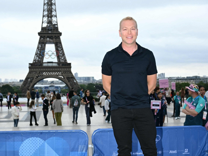 (Files) Britain's former track cyclist Chris Hoy poses for a photo ahead of the opening ceremony of the Paris 2024 Olympic Games in Paris on July 26, 2024, in front of the Eiffel Tower. (Photo by Jonathan Nackstrand / AFP)