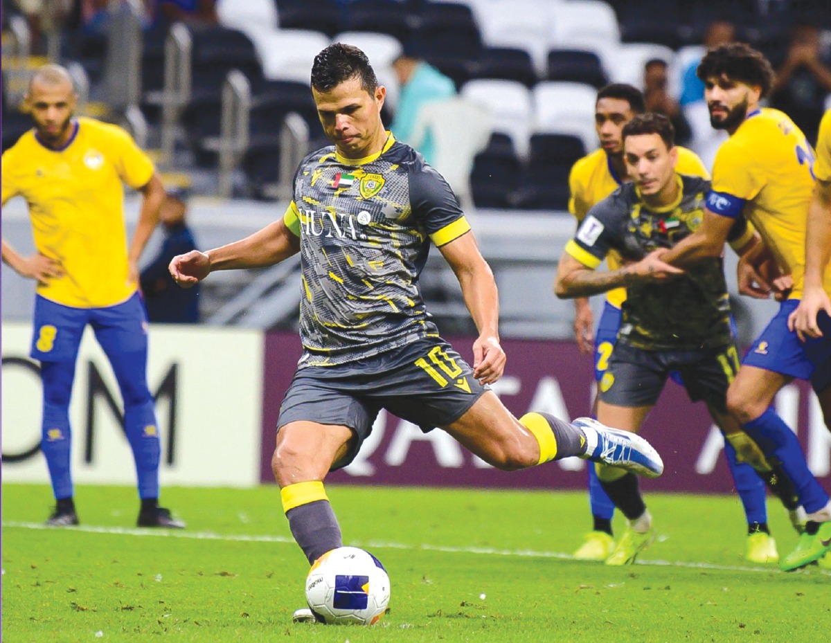 Fabio Lima scores Al Wasl's first goal from the penalty spot.