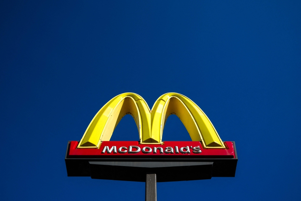 The McDonald's logo is pictured in front of a store in Dearborn, Michigan, on October 17, 2024. Photo by Charly TRIBALLEAU / AFP