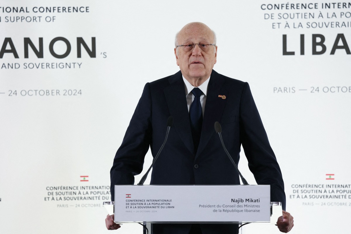 Lebanon's Prime Minister Najib Mikati speaks during a press conference after an international aid conference in support of Lebanon, in Paris on October 24, 2024. (Photo by ALAIN JOCARD / AFP)
