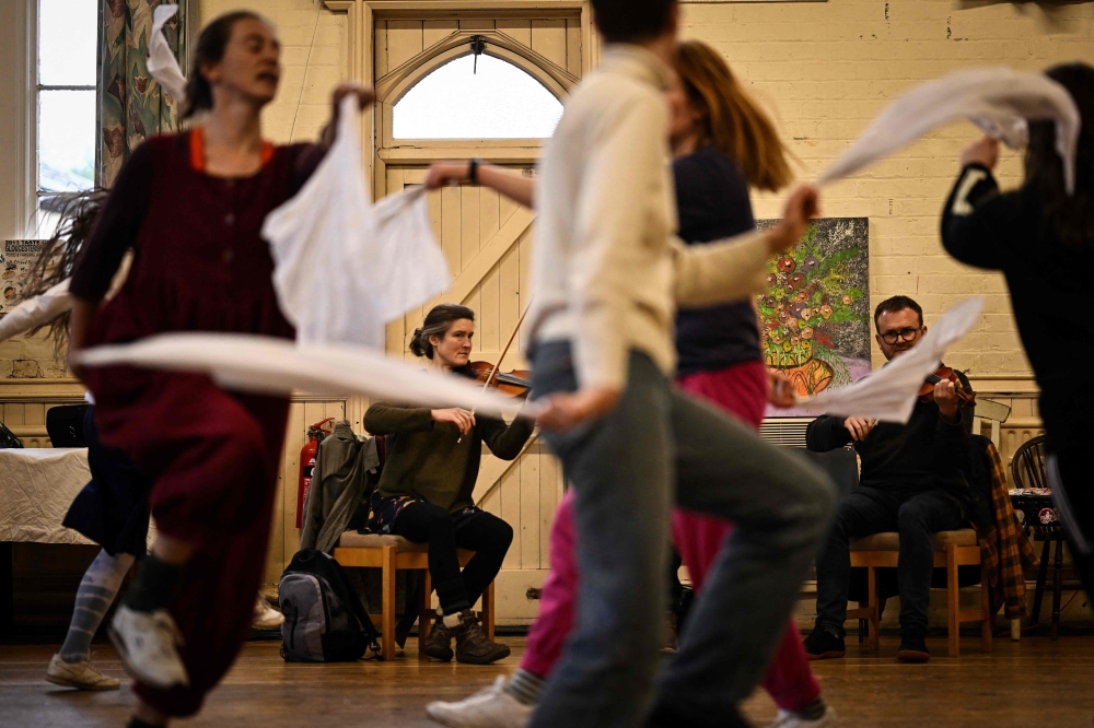 Members of Boss Morris dancing group take part in a practise session at the Stroud baptist Church hall, in Stroud, west England, on April 30, 2024. Photo by Ben STANSALL / AFP