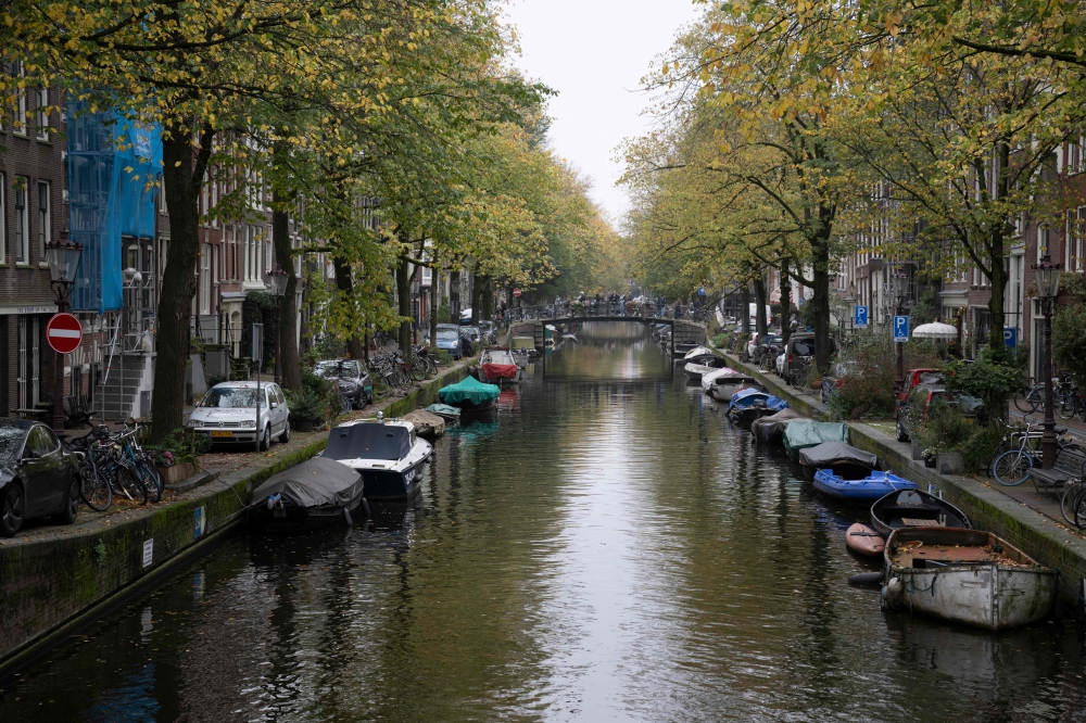 This photograph shows the Egelantiersgracht canal in Amsterdam on October 23, 2024, as the city launches its 750th anniversary celebrations. Photo by Nick Gammon / AFP