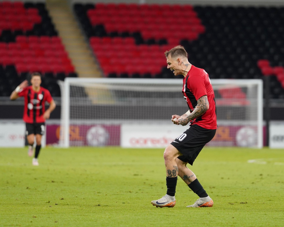 Al Rayyan's Roger Guedes celebrates after scoring his second goal against Al Ahli.