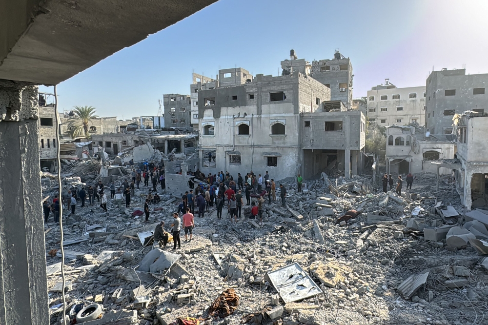 Palestinians inspect the damage after an overnight Israeli airstrike in Beit Lahia the northern Gaza Strip on October 27, 2024. Photo by AFP