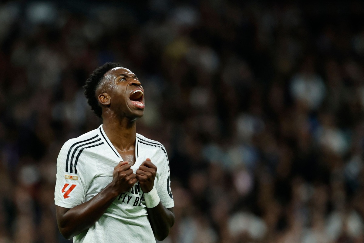 Real Madrid's Brazilian forward #07 Vinicius Junior reacts during the Spanish league football match between Real Madrid CF and FC Barcelona at the Santiago Bernabeu stadium in Madrid on October 26, 2024. (Photo by OSCAR DEL POZO / AFP)
