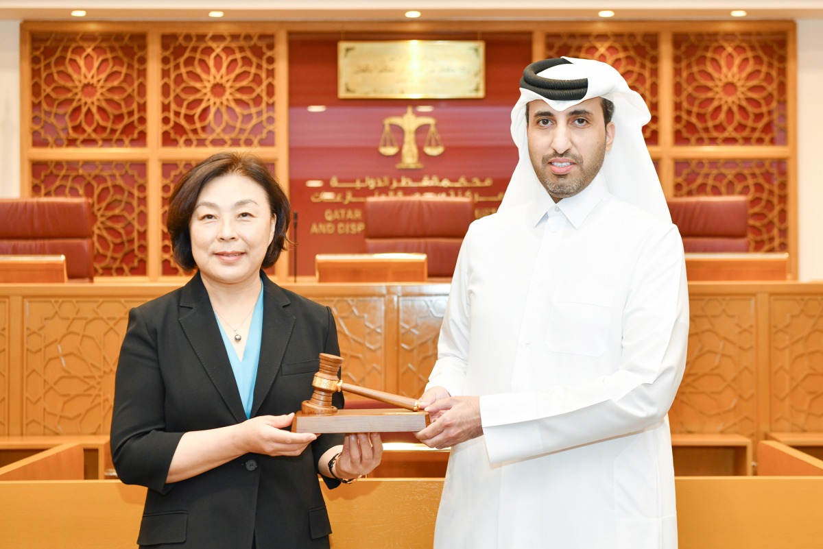 CEO of QICDRC  Faisal Rashid Al Sahouti and President of the Shanghai Financial Court Judge Zhao Hong.