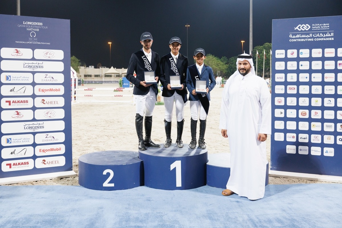 The podium winners of the Amateur class pose for a photograph with QEF’s Director of Support Services Sector Omar Al Buainain.