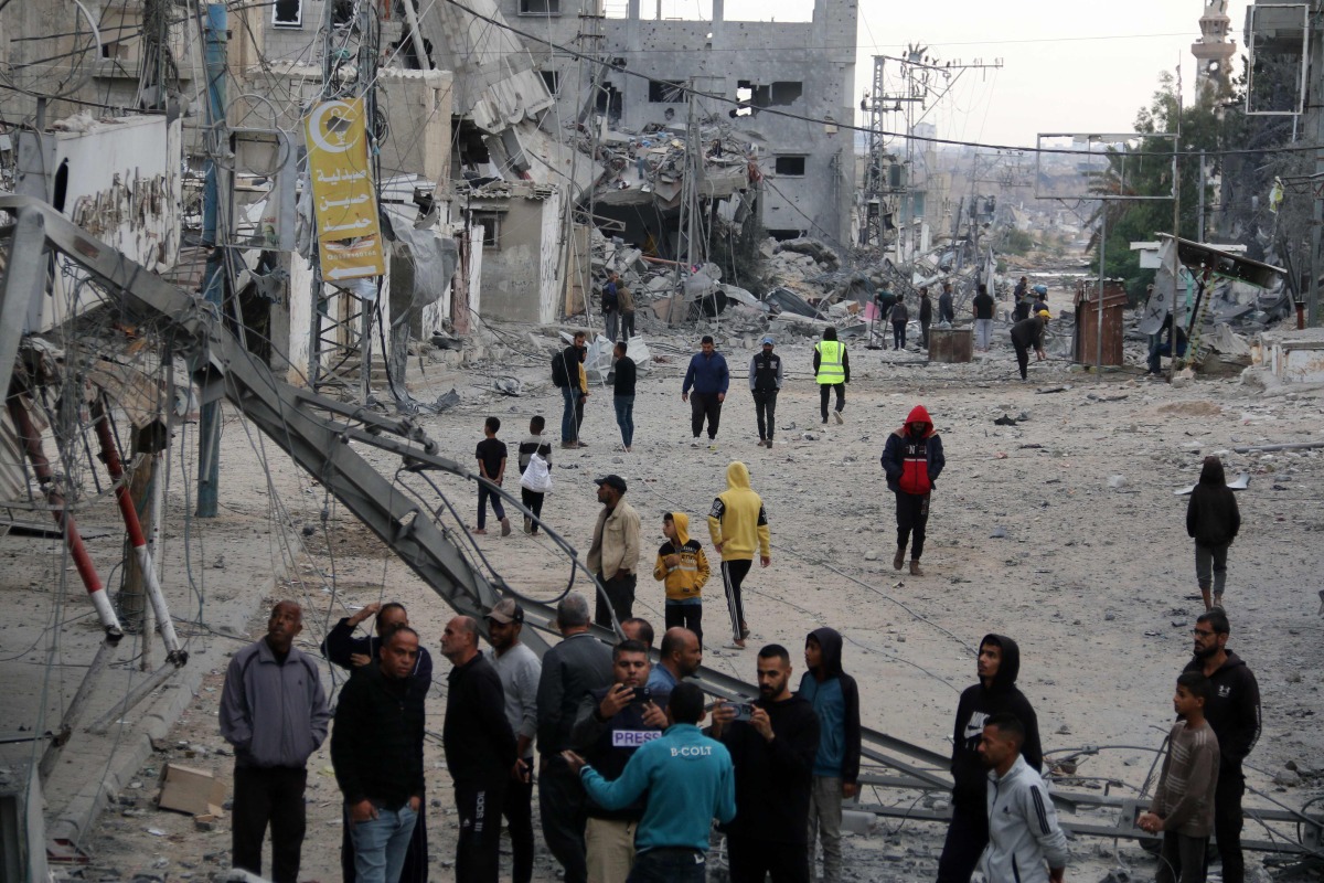 Palestinians check the damage following Israeli strikes in Nuseirat refugee camp in the central Gaza Strip, on November 1, 2024. (Photo by Eyad BABA / AFP)