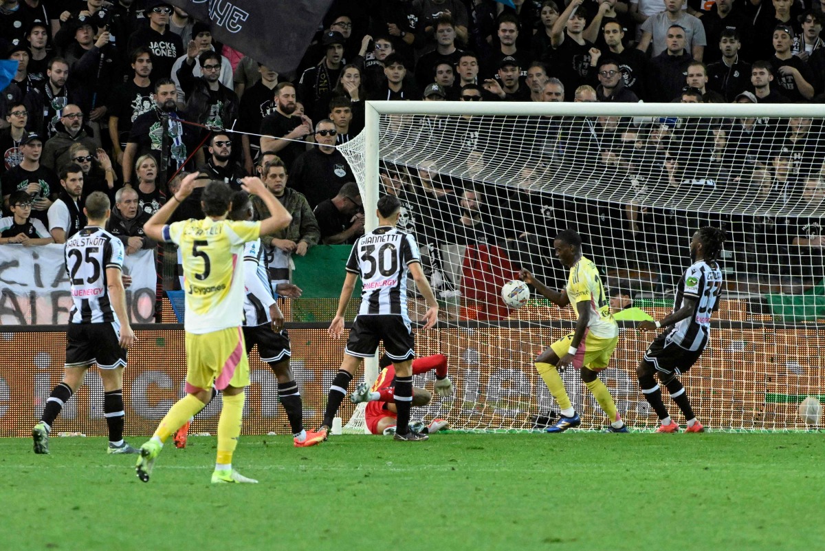 Juventus' American forward #22 Tim Weah (2-R) celebrates his team's goal during the Italian Serie A football match between Udinese and Juventus at the Friuli Stadium in Udine, northeastern Italy, on November 2, 2024. (Photo by ANDREA PATTARO / AFP)
