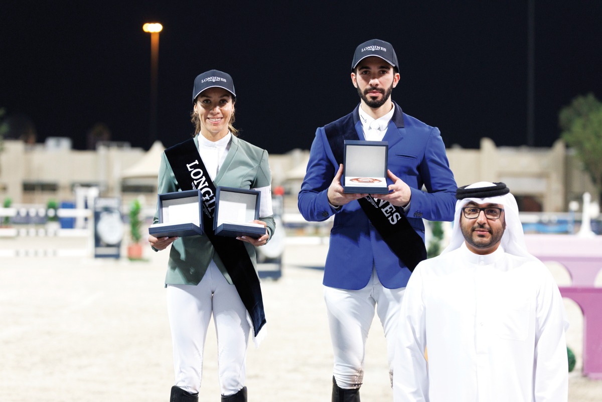 Director of the First Equestrian Team Fahad Rashid Al Amri poses for a photograph with the Big Tour podium winners Cyrine Cherif and Khalid Mohammed Al Emadi. 