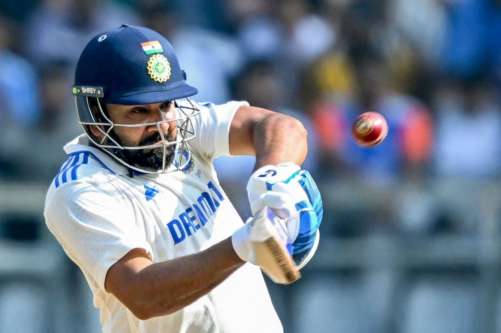 India's captain Rohit Sharma plays a shot during the third day of the third and final Test cricket match between India and New Zealand at the Wankhede Stadium in Mumbai on November 3, 2024. (Photo by Indranil Mukherjee / AFP) /