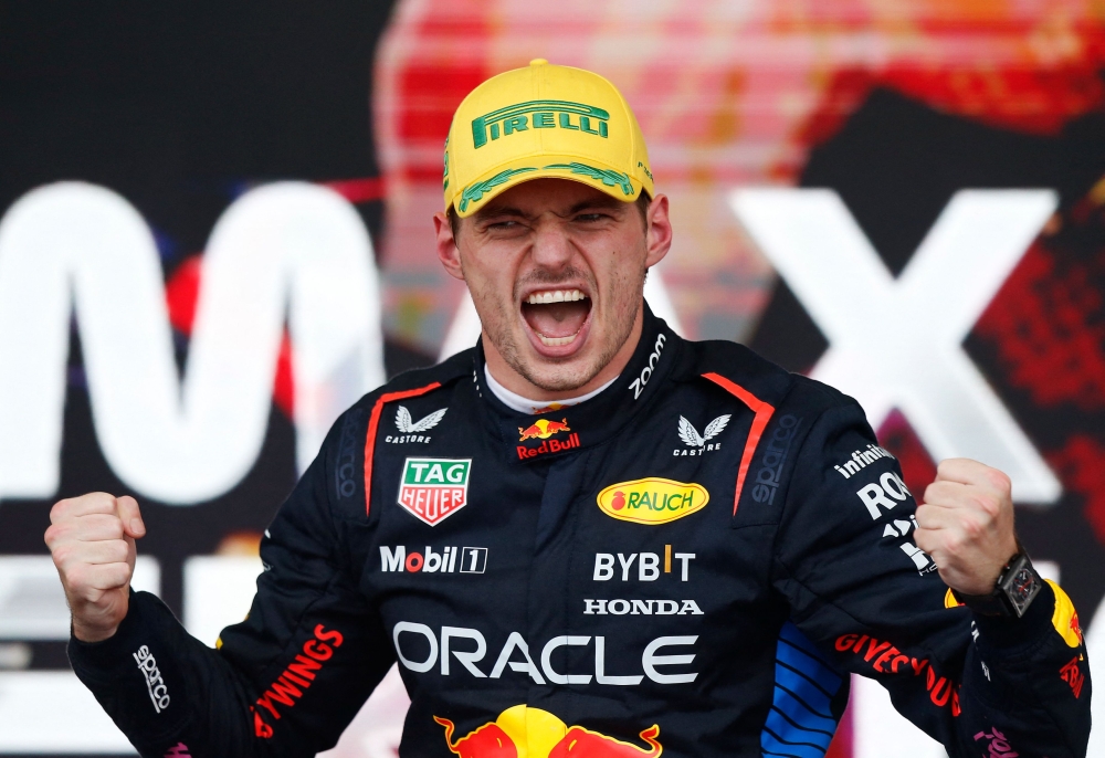 Red Bull Racing's Dutch driver Max Verstappen celebrates at the podium of the Formula One Sao Paulo Grand Prix, at the Jose Carlos Pace racetrack, aka Interlagos, in Sao Paulo, Brazil, on November 3, 2024. (Photo by Miguel Schincariol / AFP)