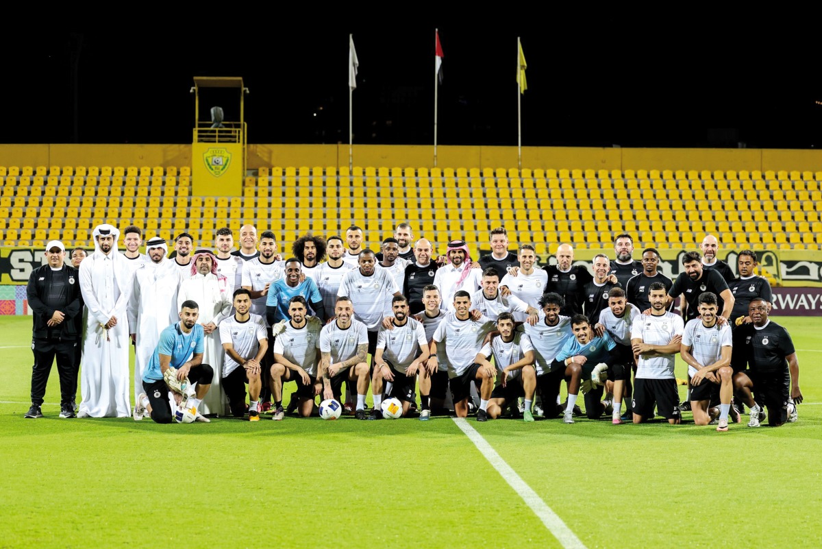 Al Sadd players and officials pose for a photograph at Zabeel Stadium in Zabeel, Dubai, on the eve of the match against Al Wasl.