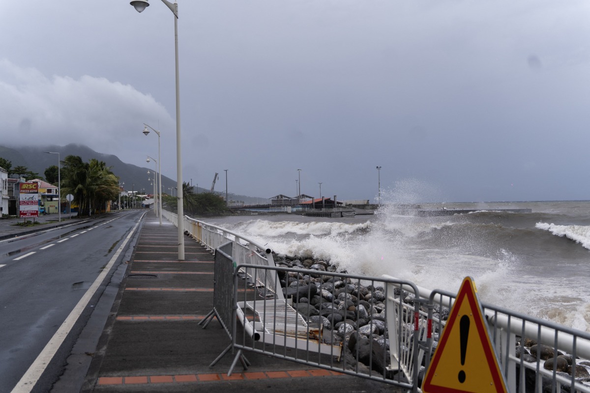 File photo for representational purposes. This photograph shows waves crashing against the shoreline in the aftermath of tropical storm Ernesto, in the town of Basse-Terre, on the French Caribbean island of Guadeloupe, on August 13, 2024. (Photo by Brian NOCANDY / AFP)